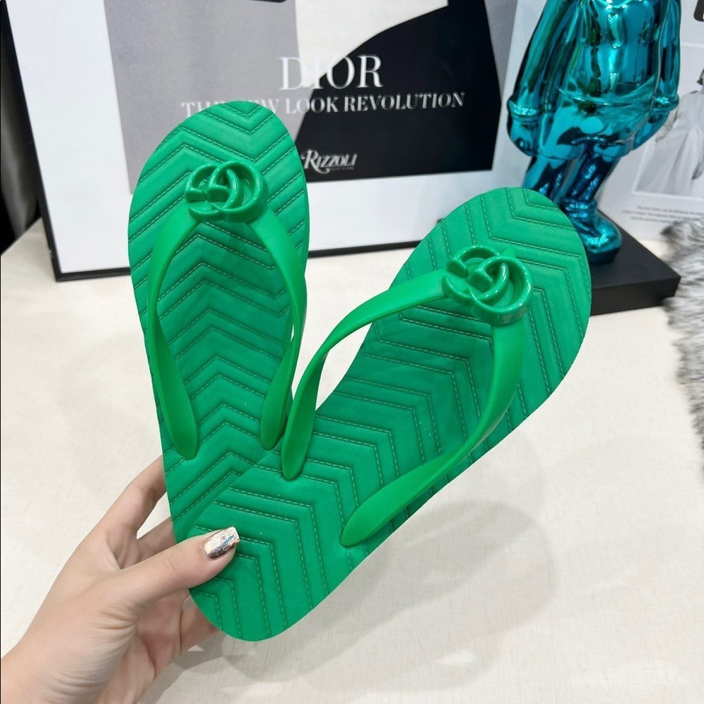 Green Gucci rubber thongs